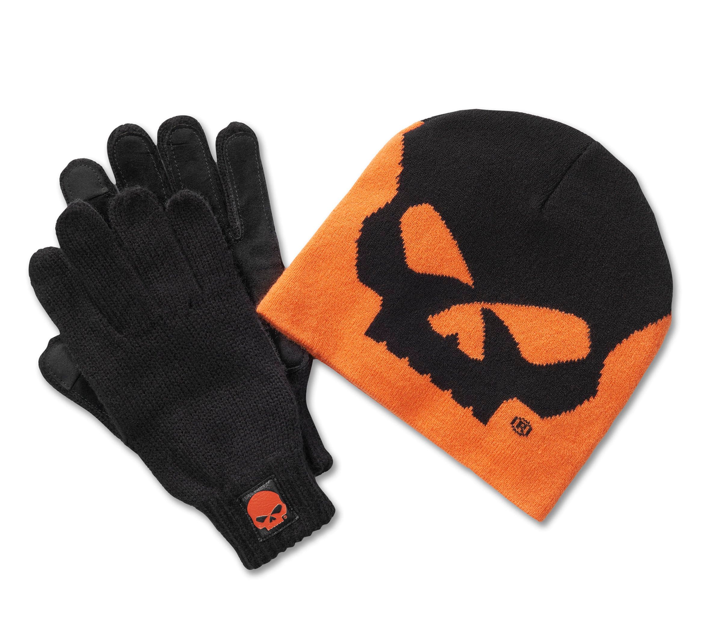 2024 Winter GM Tabletop Set abbigliamento Harley-Davidson: berretto in maglia nero e arancione con design teschio, guanti in maglia neri con patch teschio arancione.